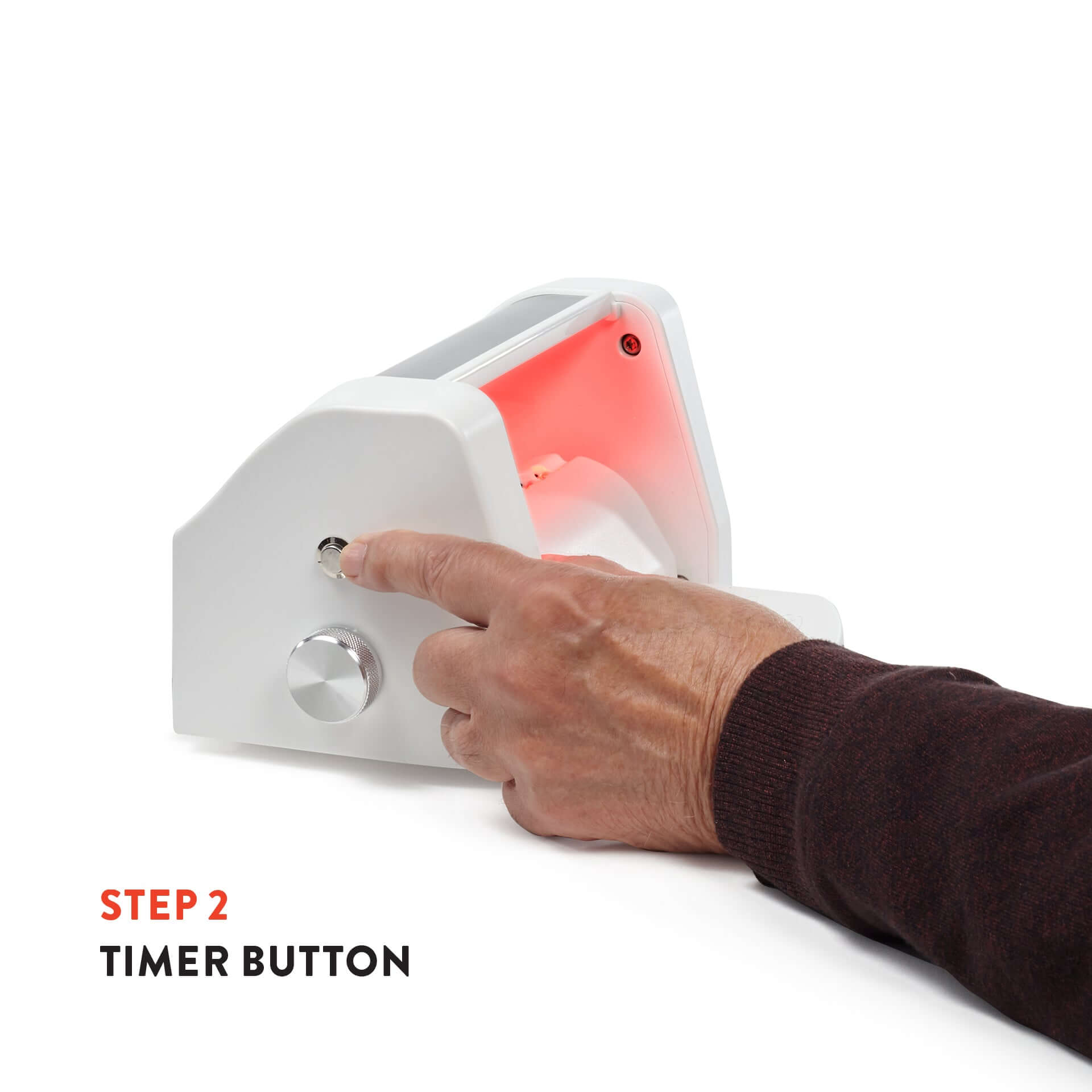 Timer button on the Triumph Hand Therapy Device