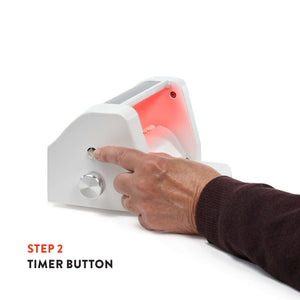 Timer button on the Triumph Hand Therapy Device